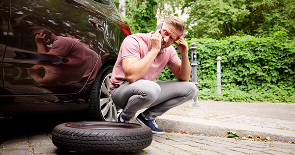How to Change a Flat Tire Safely on the Side of the Road